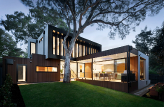 the exterior of a modern home at night